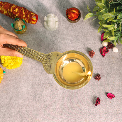 Brass diya with long handle 